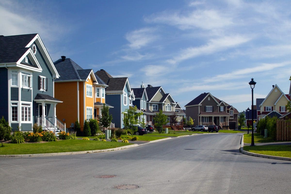 houses aligned in residential neighborhood that will need hvac services