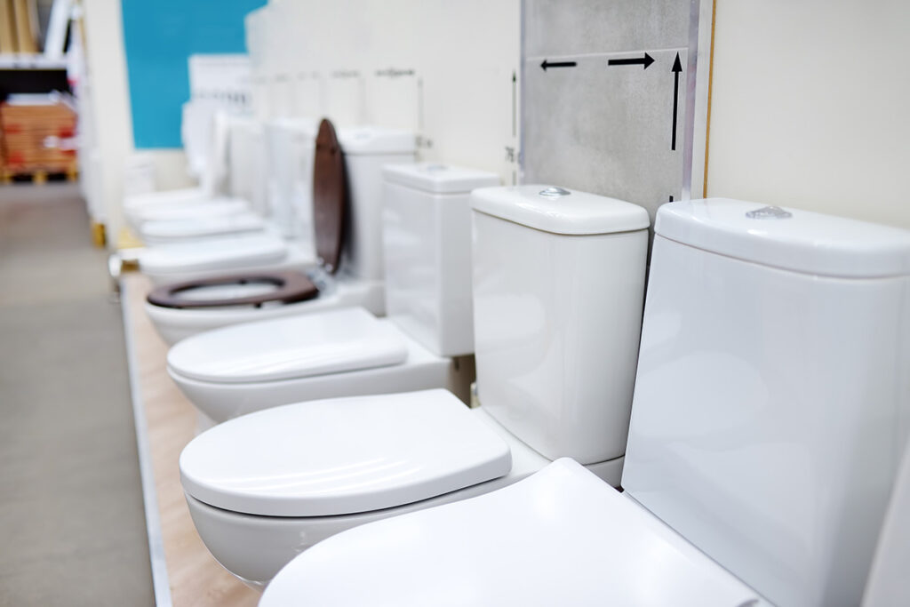 line of toilets in store that are ready to be installed